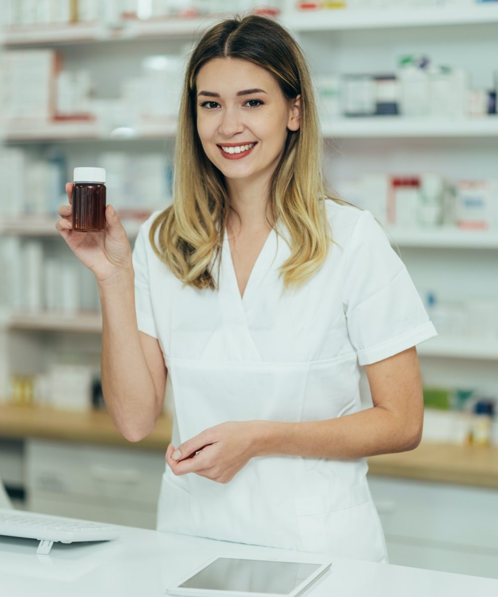 portrait-of-a-beautiful-female-pharmacist-working-in-a-pharmacy-1.jpg